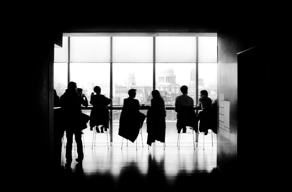 Silhouette photo of people in meeting room 